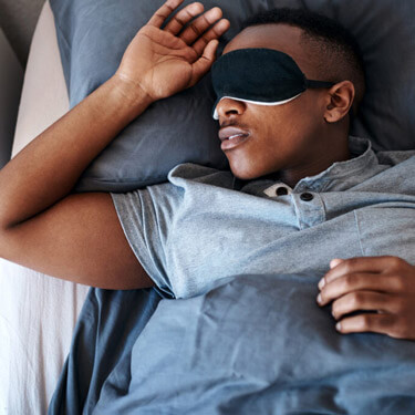 Man sleeping in facemask