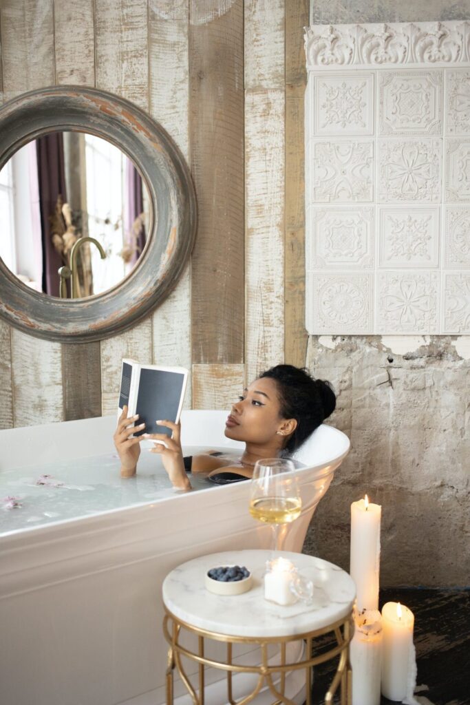 Woman reading in a bathtub, hoping to beat insomnia