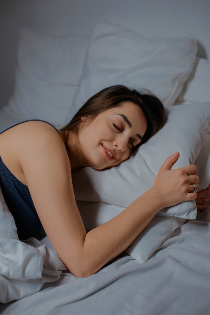 Woman feeling very happy with her new pillow