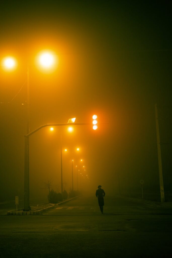 Person walking alone at night